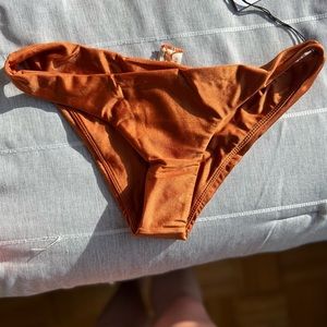 Balboa Top in Rustic Orange. Never worn. Tags still on top and bottom